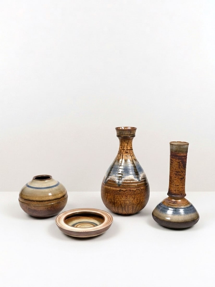 Nanni Valentini (Sant'Angelo in Vado 1932 - 1985), GLAZED CERAMIC GROUP, circa 1970s: From h cm 3 x d cm 15 To h cm 26 x w cm 16 Set comprising three vases and one bowl for Ceramiche di Arcore, Italy.