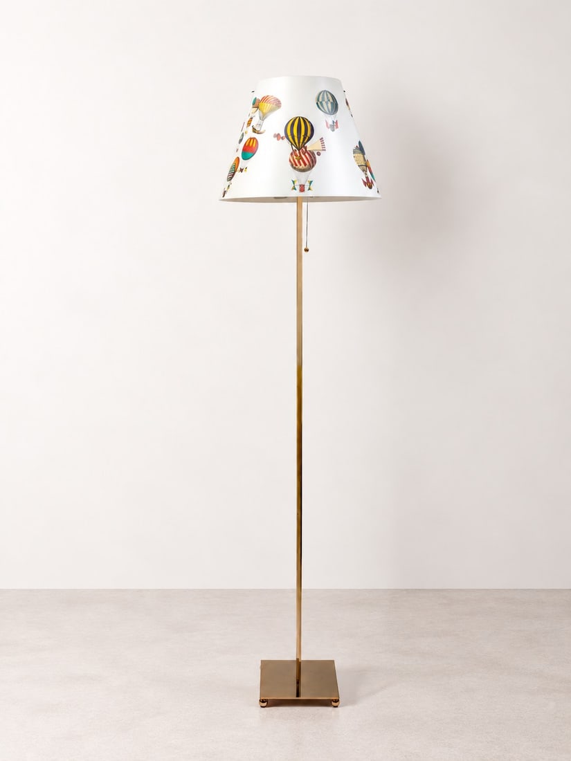 Fornasetti Milano, FLOOR LAMP, circa 1990: h cm 160 Metal frame with plastic shade decorated with the "Mongolfiere" motif. Antonangeli production, Italy; shade signed Fornasetti.