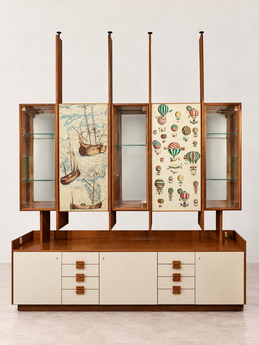 Piero Fornasetti e Carlo Alberto Bordogna, MODULAR BOOKCASE, circa 1950s: l cm 242 x h cm 287 x w cm 50 Veneered wood with open compartments, glazed display cabinets with mirrored backs, doors decorated with Piero Fornasetti screen-printed panels from the "Galeoni" and "Mon