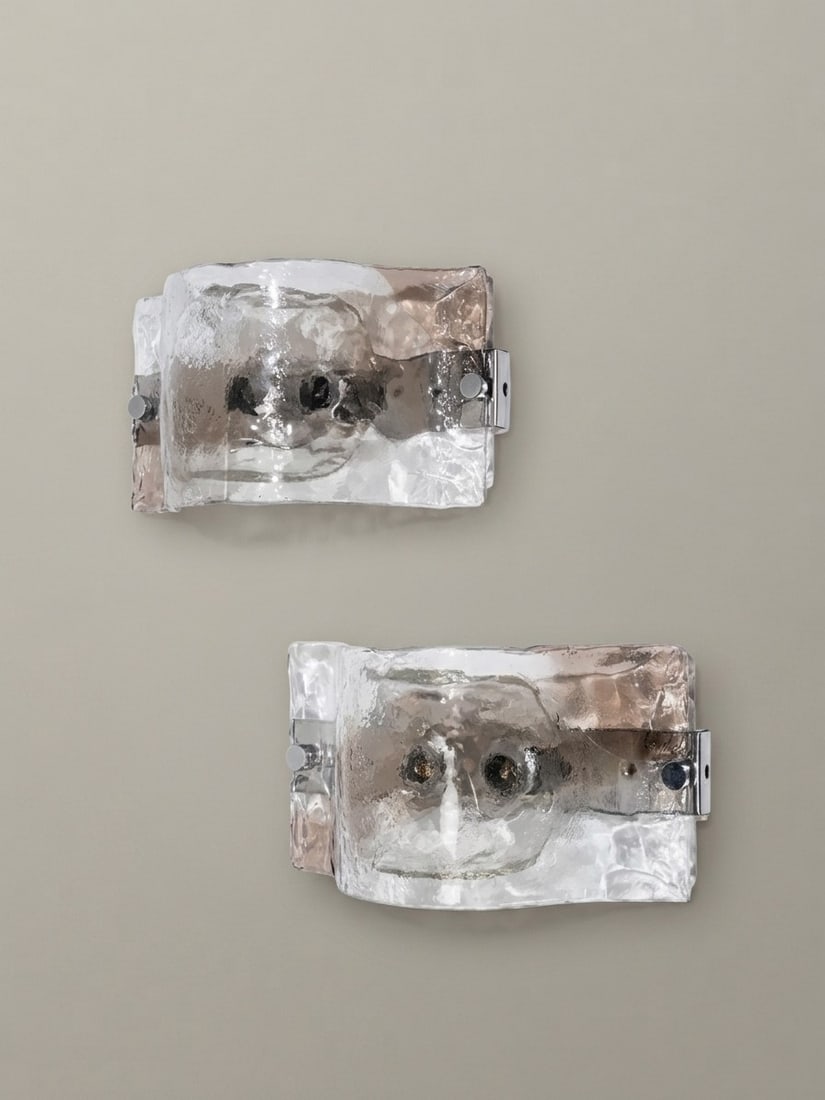 Carlo Nason (Murano 1935), MODEL LP276 WALL LIGHTS, circa 1970s: l cm 18 x h cm 34 Pair. Thick Murano glass diffusers with relief decoration, chrome-plated metal supports. Produced by A.V. Mazzega, Italy.