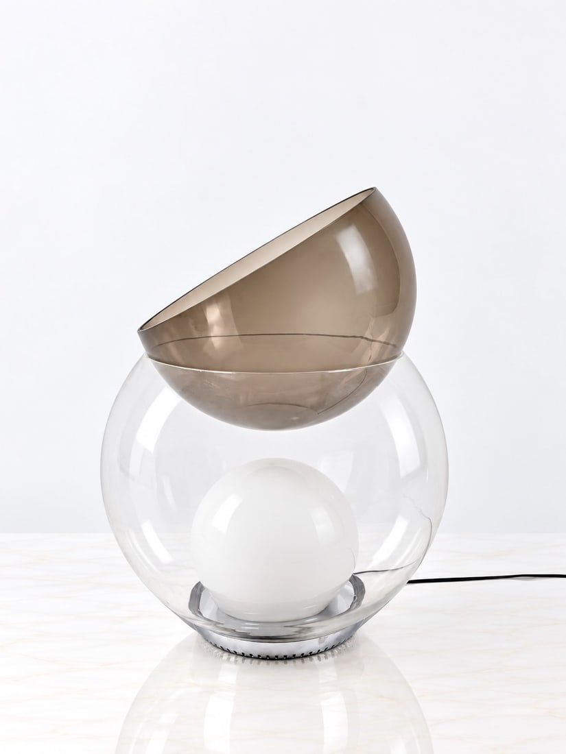 Gae Aulenti (Palazzolo dello Stella 1927 - 2012), "GIOVA" TABLE LAMP, circa 1990s: h cm 59 x d cm 50 Clear glass, smoked glass and opaline glass. Produced by Fontana Arte, Italy.