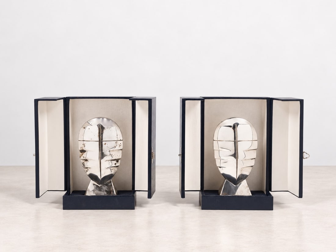 Pierre Cardin (Sant'Andrea di Barbarana 1922 - 2020), SILVER SCULPTURES, circa 1990s: h cm 15,5 x l max cm 8,5 Pair. Weight 1,250 g. Complete with original cases. Silver hallmark not present.