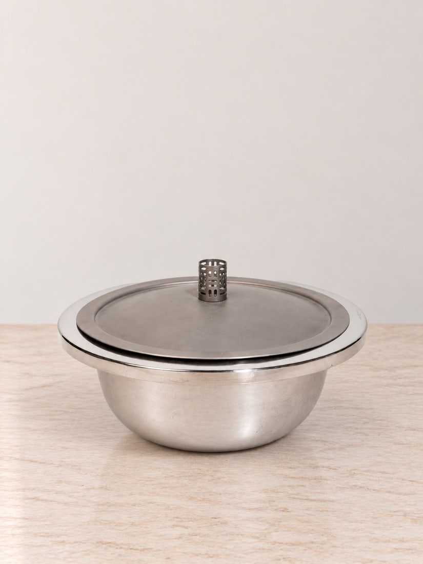 Afra e Tobia Scarpa, RISOTTO PAN, 1999: d cm 28 999 silver with metal lid. Part of the Cooking in Pure Silver collection. Produced by San Lorenzo, Italy.Weight (without cover): g 1222
