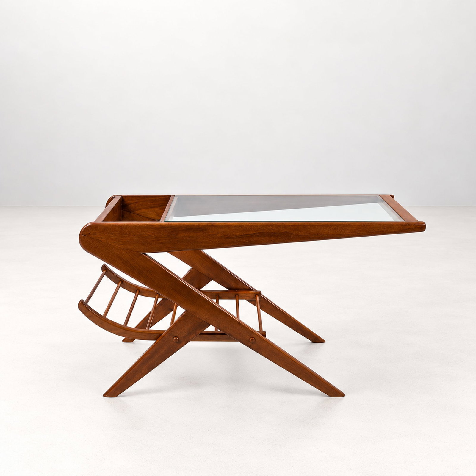 LOW TABLE WITH MAGAZINE RACK, circa 1960s: l cm 100 x h cm 50 x w cm 40 Solid wood with glass top and integrated lower magazine rack. South American production.
