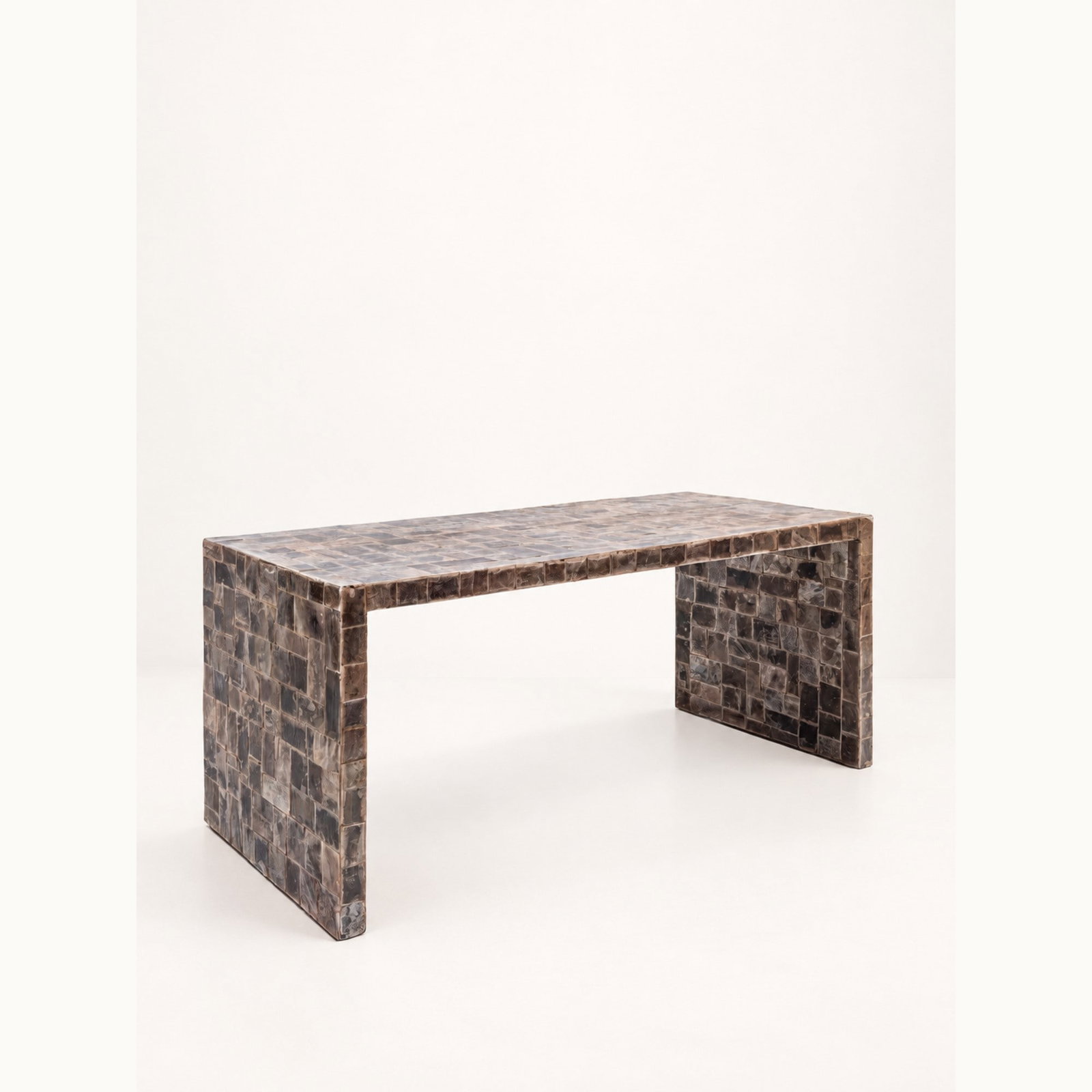 LOW TABLE, circa 1950s: l cm 96 x h cm 41 x p cm 43 Clad in natural mica tiles. In the style of Jean-Michel Frank. South American production.