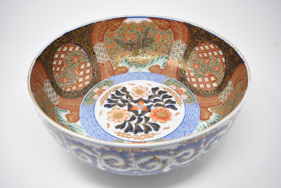 Chinese Porcelain Bowl: Gorgeous large porcelain bowl enameled in striking colors of cinnabar, cobalt blue, cream, jade and white. Stamped on bottom. Diameter: 12.25"; 5"h