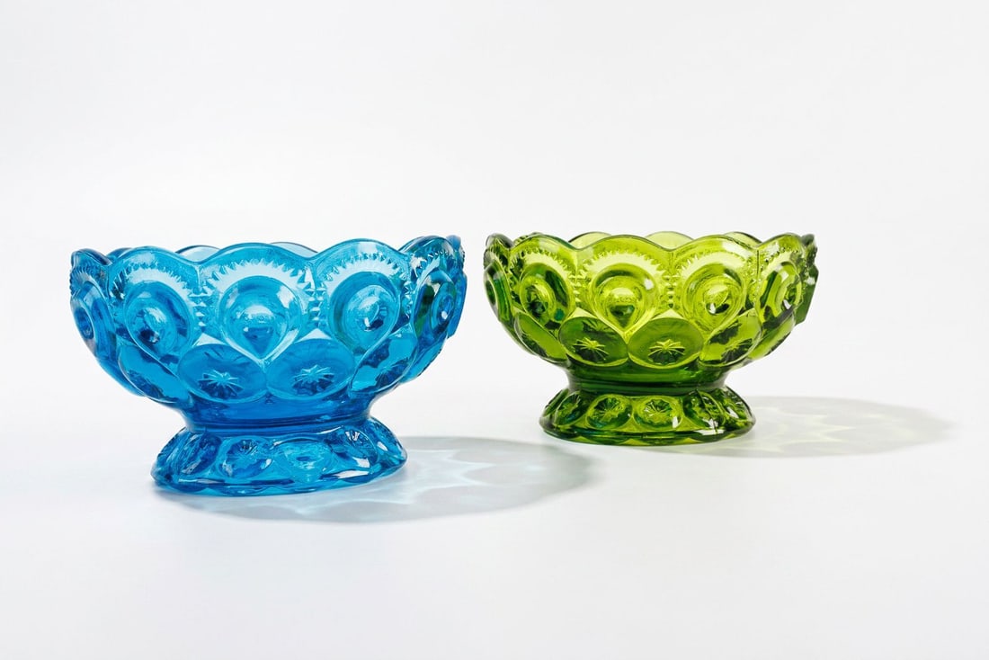 2 Vintage L.E. Smith "Moon & Stars" Glass Pedestal Compotes: 2 vintage L.E. Smith Moon & Stars glass pedestal compote dishes.? Features one green and one blue.? Gorgeous colors!? Items produced in the 60s and 70s.? Small chip on base of the blue one and rim of