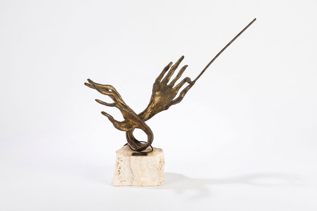 Diminutive Bronze Sculpture - "Composer" by Emanuele Scarnicci (1916-): This diminutive bronze sculpture by noted Italian artist Emanuele Scarnicci (1916-) depicts a pair elongated hands that hold a conductor's baton, leading a silent orchestra to the viewer. This