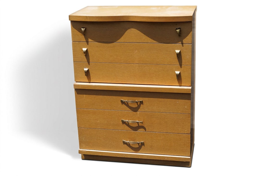 Vintage MCM 6-Drawer Dresser: Crafted with a sleek, geometric silhouette, this mid-century modern dresser is equipped with six drawers that allow for a generous amount of storage. This dresser is outfitted with brass hardware