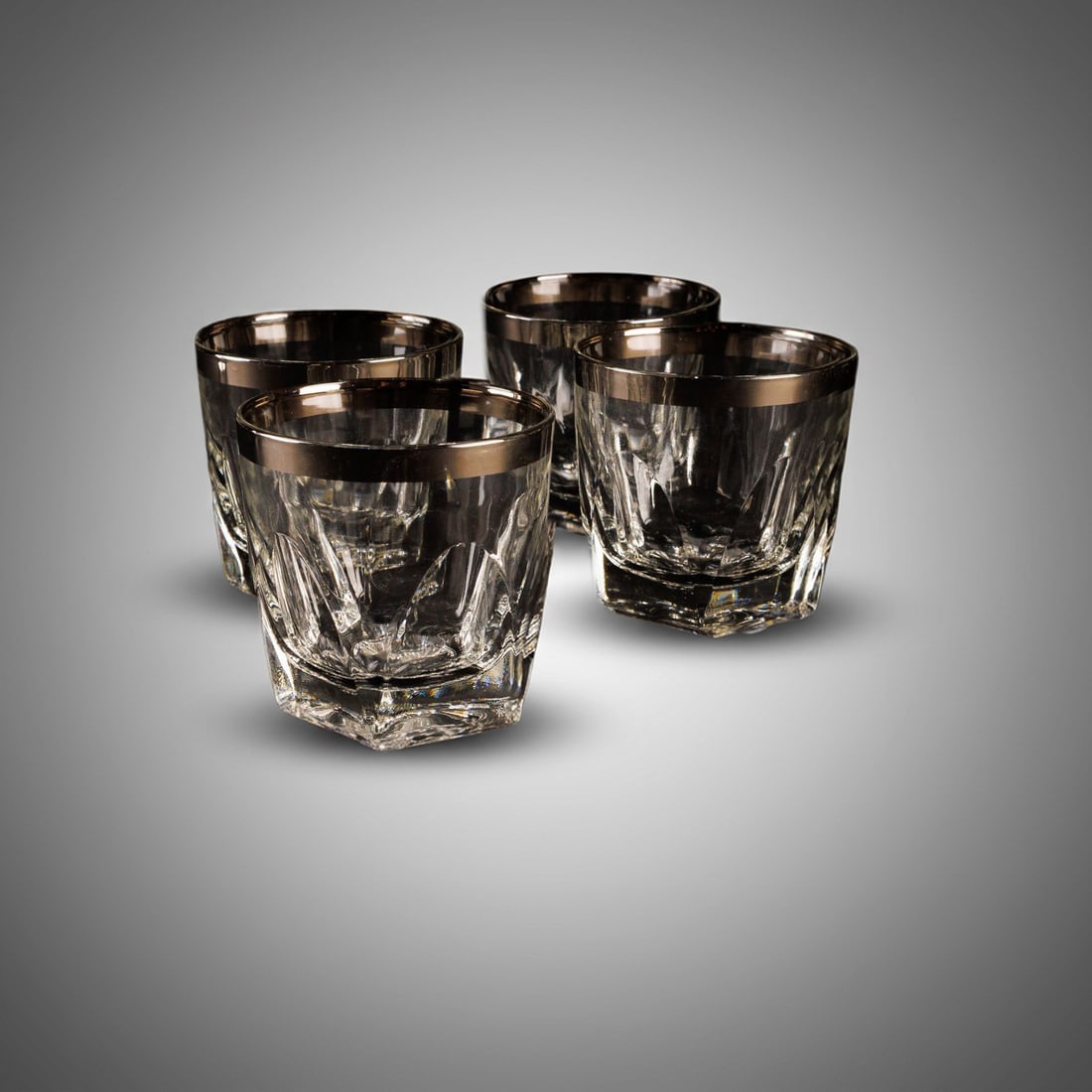 Hazel Atlas Gothic Rocks Glasses: Four Hazel Atlas Gothic old fashioned / whiskey glass with arched panels and a wide platinum band. Some minor loss is evident on some of the platinum band.?