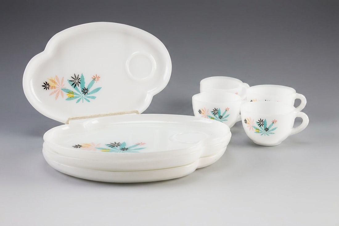 Vintage Federal Glass Company Atomic Flower Snack Set: Vintage Federal Glass Company atomic flower milk glass teacups and matching snack plates. Very Good condition overall but there are some minor pin pricks on some portions of the graphics. See photos