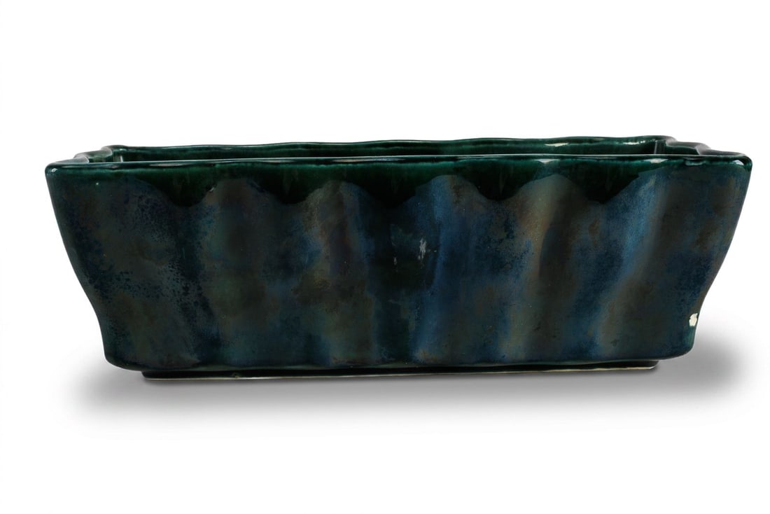 Hull F47 MCM Rectangular Planter: Green drip glaze planter with rippled surface. One corner has a small area of exposed ceramic, please see photos for more details.?
