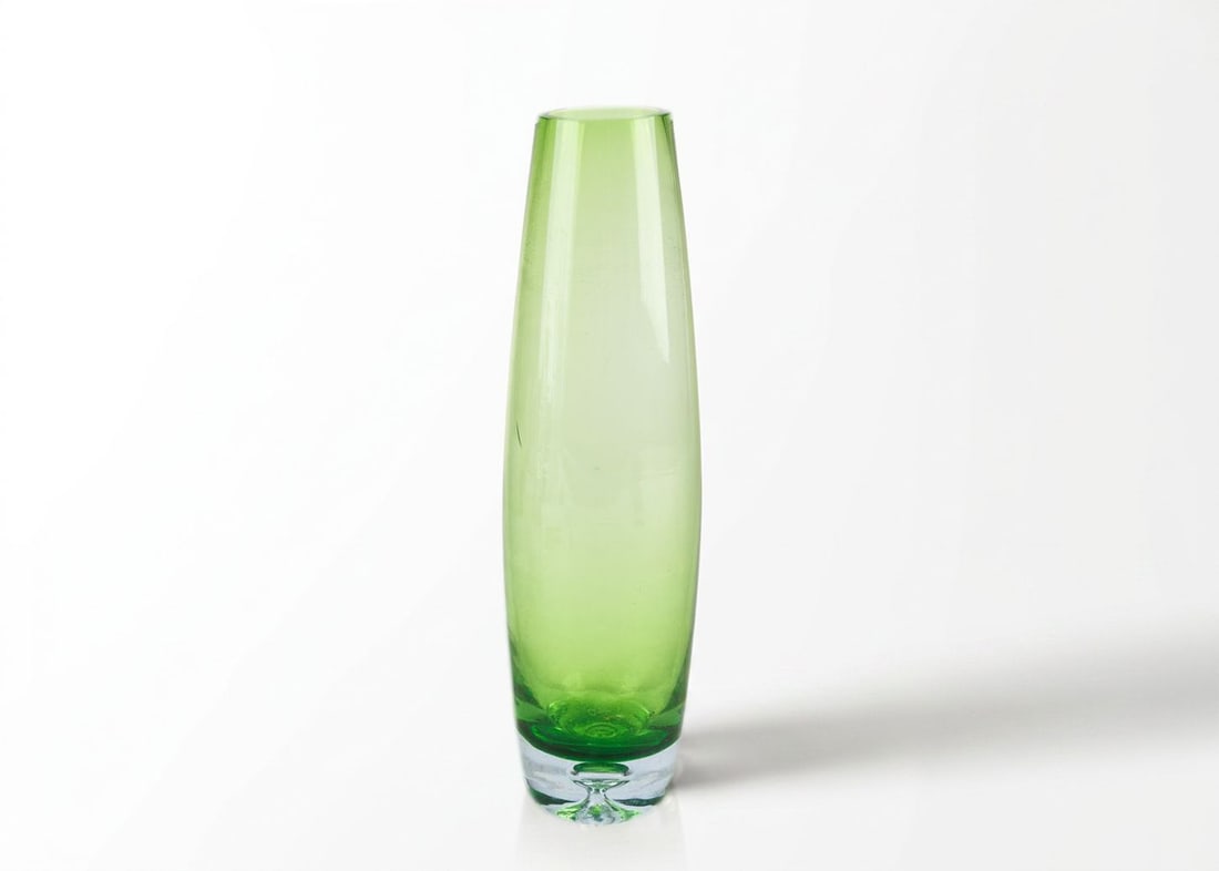 Mid Century Hand Blown Art Glass Green Vase: Mid century hand blown art glass green vase.? Nice solid clear base with a clear bubble and a vibrant green color.? Great for flowers or to add to any table.? See photos for details.