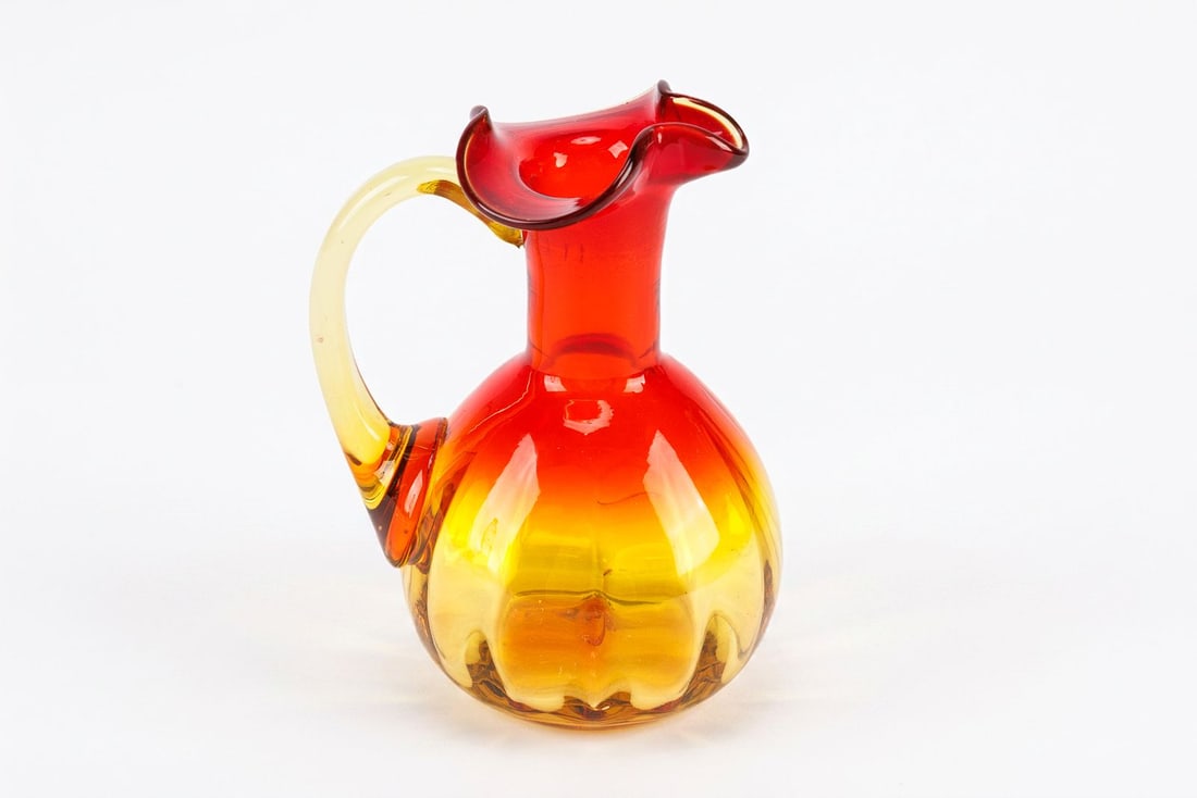 Small Hand-Blown Art Glass Pitcher: This item is a small amber/orange art glass cruet. Includes small scratches on the bottom consistent with use, see photos for details.