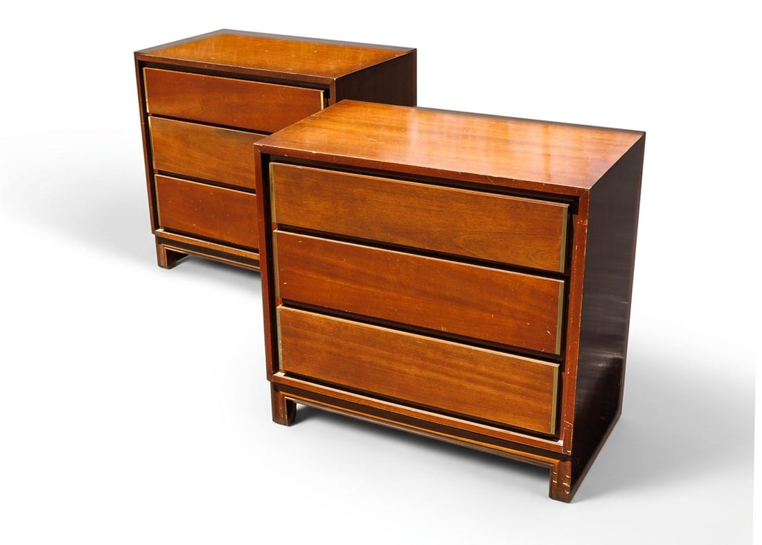 Pair of Vintage MCM Nightstands: Crafted from walnut, this pair of vintage nightstands each detail a classic, Mid-Century Modern styling and are equipped with three drawers for generous storage. These nightstands feature integrated