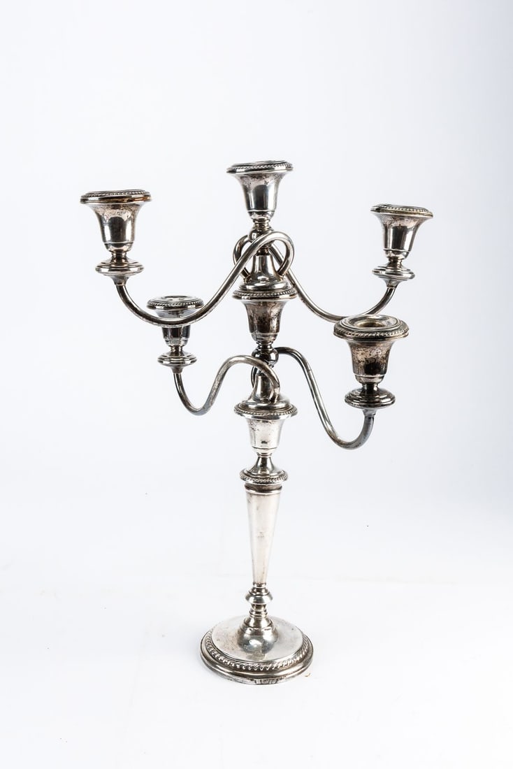 Stunning Weighted Sterling Silver Four-arm Candelabra: Very large sterling silver weighted candelabra. The top and middle sections do unscrew and can be used interchangeably as desired. There are minor dings, dents and scratches to the arms and base.