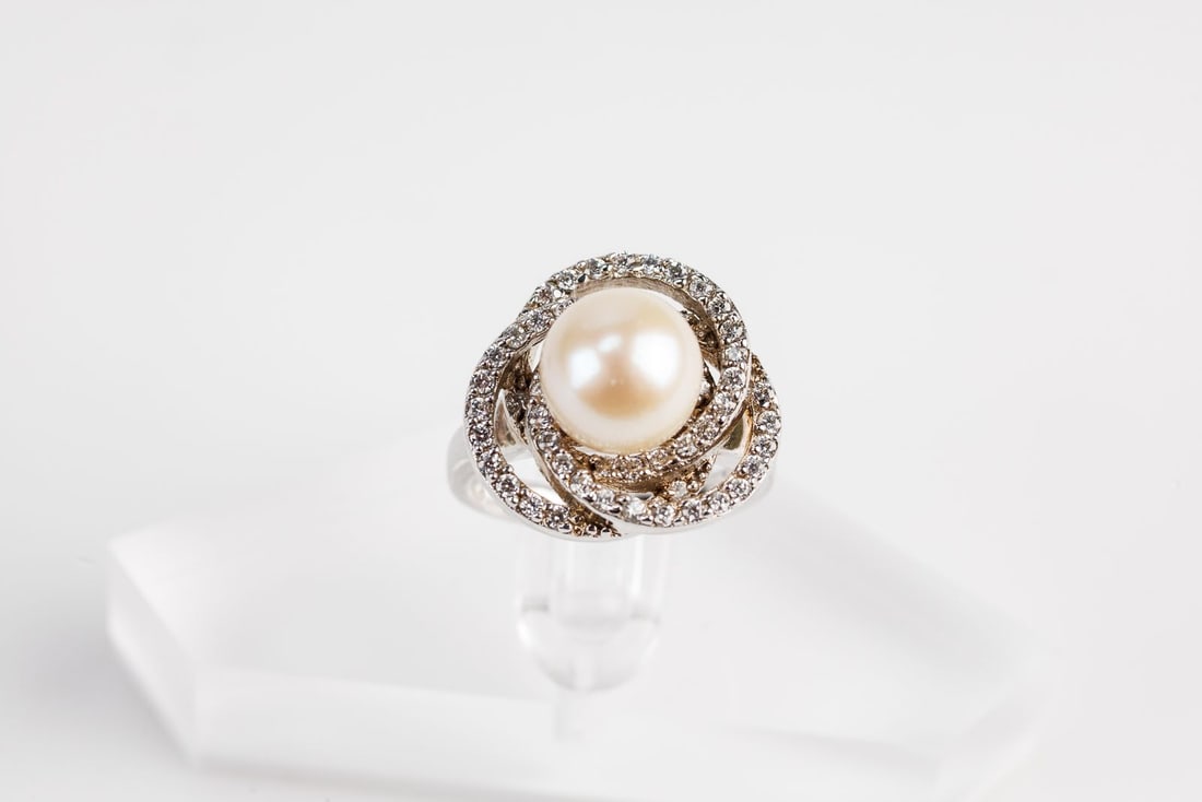 Sterling Silver and Natural Pearl Ring- Size 6: Sterling silver ring with natural pearl and cubic zirconias. Size 6. Pretty! Total weight is 8.04 grams. See photos.