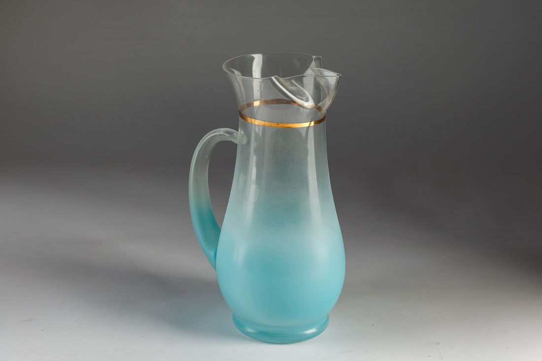Vintage Blendo Frosted Glass Pitcher: Vintage light blue Blendo West Virginia Glass pitcher. There is a faint remnant of adhesive from a price sticker. Please see photos for more details.