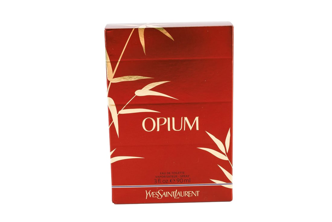 Yves Saint Laurent Opium Eau De Toilette Spray!: Yves Saint Laurent Opium Eau De Toilette spray. Is a 3oz bottle in the original box. Features a red box with gold bamboo leaf motif. The scent is a lovely spicy fragrance with hints of mandarin, jasmi
