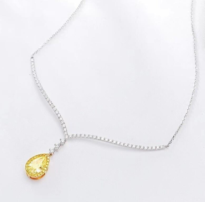 1ct Natural Yellow Diamond 18K Gold Necklace: 18K gold set with 1.02ct South African natural yellow diamond, matched with 0.65cts natural diamonds. Bright color, shining and dazzling, good clarity. Shape: Pear-shaped. Cut: Excellent. Internationa