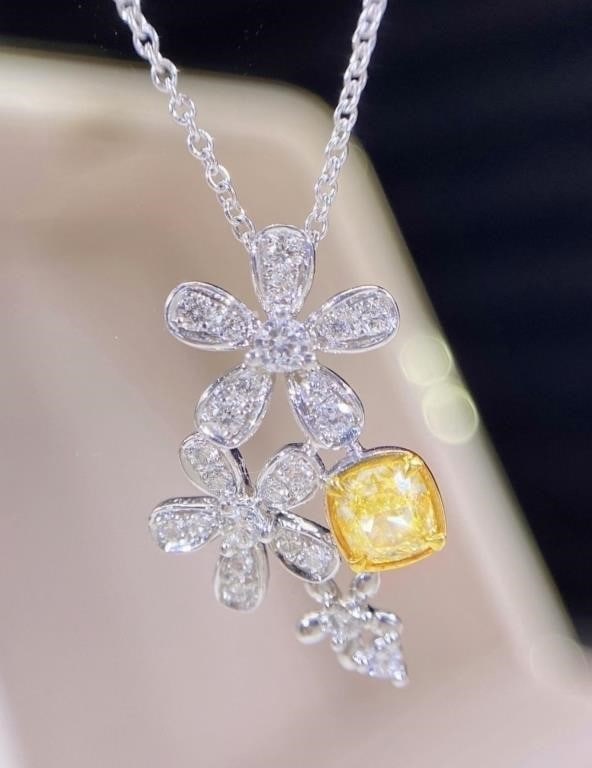 Natural Yellow Diamond 18Kt Gold Pendant: 18Kt gold set with 0.3ct South African natural yellow diamond, matched with 0.23cts natural diamonds. Bright color, shining and dazzling, good clarity. Shape: Cushion-shaped. Cut: Excellent. Internati