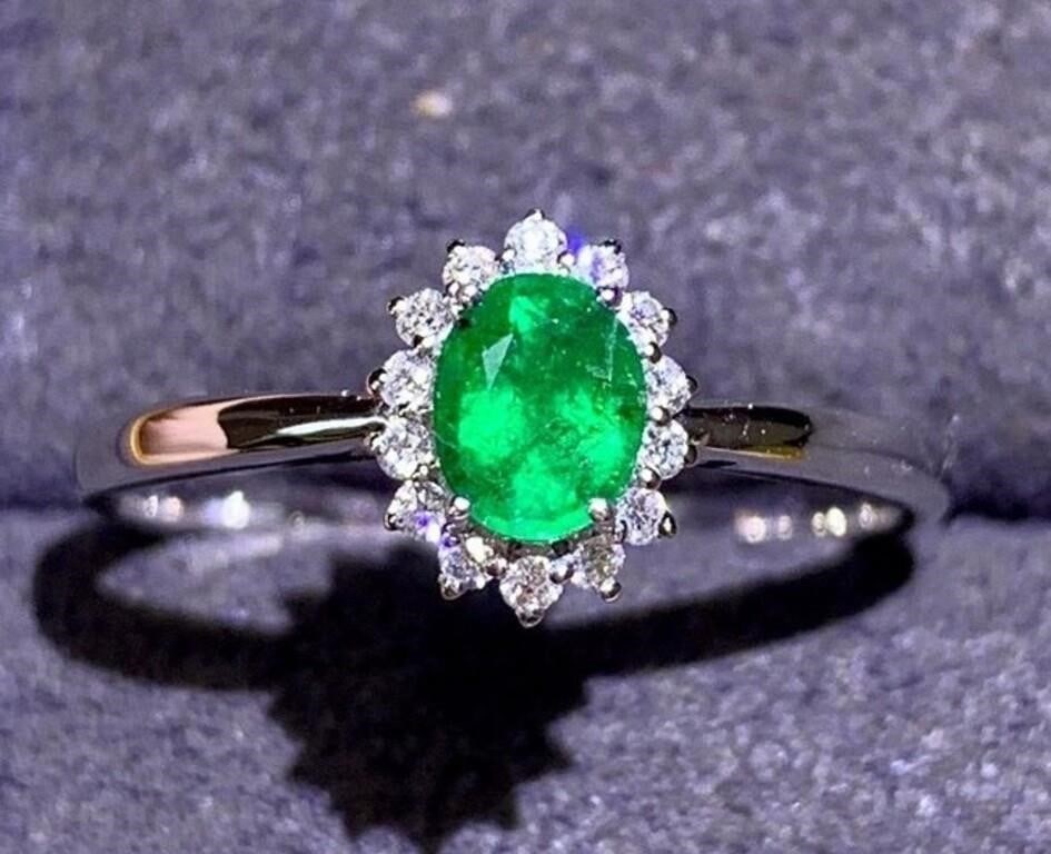 Zambian Emerald 18Kt Gold Ring: 18Kt gold deluxe set with 0.64ct Zambian natural emerald and 0.17cts natural South African diamonds, this one is stunning in terms of color and brightness, superb texture. Overall condition is excelle
