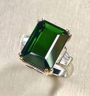 12.7ct Natural Tourmaline 18Kt Gold Ring: 18Kt gold deluxe set with 12.7ct natural tourmaline and natural South African diamonds. Gorgeous design, attractive style, rich color, clean crystal, good clarity. Overall condition is excellent.