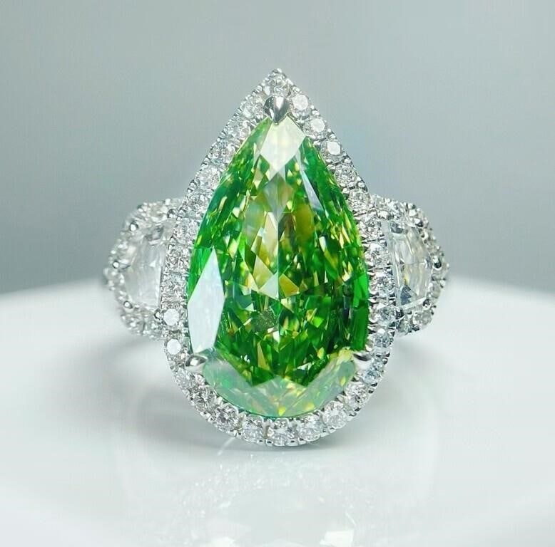 5ct Natural Green Diamond 18Kt Gold Ring: 18Kt gold inlaid natural high quality diamonds, main stone: 5ct Green Diamond, accessory stone: 0.91cts white diamonds. Green diamond adopts excellent cutting technology to maximize the natural rich c