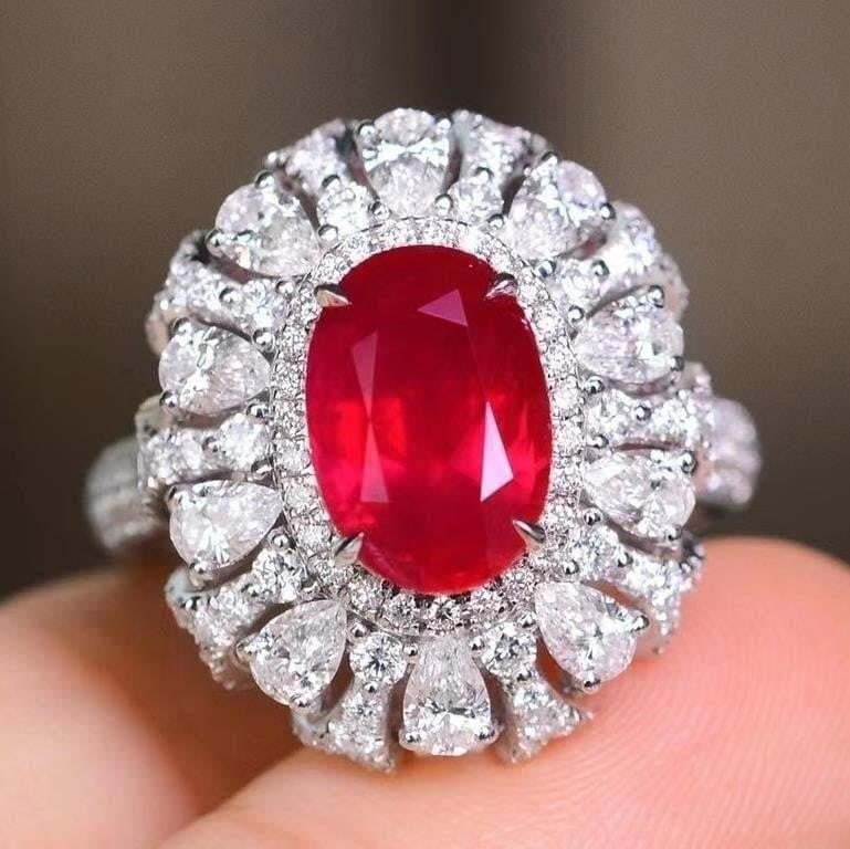 3.6ct Pigeon Blood Ruby Ring 18K Gold: 18K gold luxury set with 3.6ct natural pigeon blood ruby and 2.1cts natural South African diamonds, bright color, clean-crystal, good clarity. Shape: Oval. Cut: Excellent. Internationally certified na