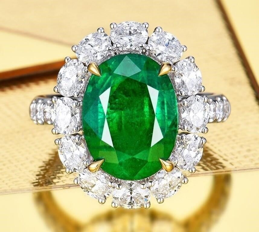 5.5ct Natural Emerald 18K Gold Ring: 18K gold deluxe set with 5.5ct natural emerald and 2cts natural South African high quality diamonds, Gorgeous design, attractive style, bright colors, crystal-clean and good clear. Overall condition i