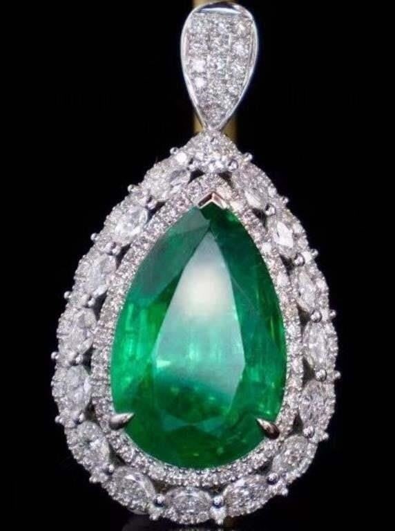 9.3ct Natural Emerald Pendant 18K Gold: 18K gold deluxe set with 9.3ct natural emeralds and 1.8cts natural South African diamonds. Bright colors, clean-crystal, good clarity. Shape: pear-shaped. Cut: Excellent. International certified natur