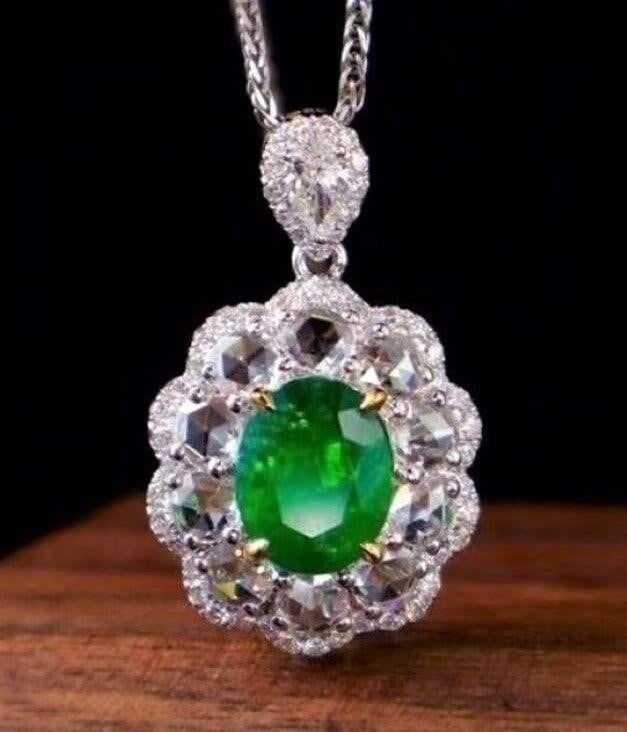3.3ct Natural Emerald 18K Gold Pendant: 18K gold set with 3.3ct natural emerald and 2.1cts natural South African high-quality diamonds, this one is stunning in terms of color and brightness, superb texture, extremely good wearing effect.