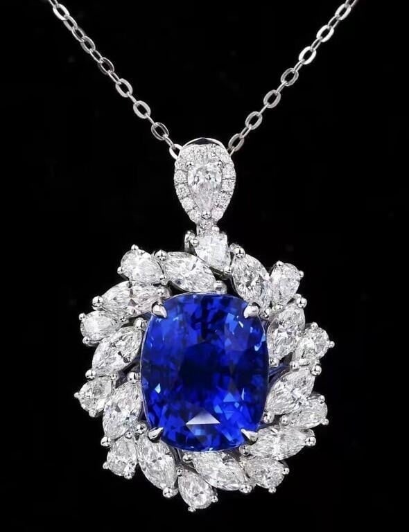9.3ct Natural Tanzanite 18K Gold Pendant: 18K gold luxury inlaid with 9.3ct natural tanzanite and 3.7cts natural South African high-quality diamonds, bright color, clean-crystal, good clarity. Gorgeous design, attractive style, handcrafted