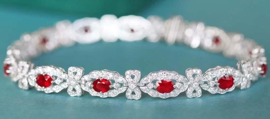 4.05ct Pigeon Blood Ruby Bracelet 18K Gold: 18K gold luxury set with 4.05cts natural pigeon blood rubies and 1.7cts natural South African diamonds, bright color, clean-crystal, good clarity. Shape: Oval. Cut: Excellent. Internationally