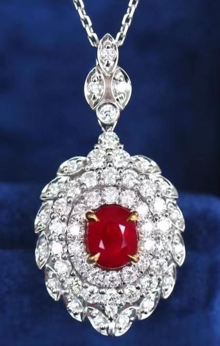 1.1ct Pigeon Blood Ruby Pendant 18K Gold: 18K gold luxury set with 1.1ct natural pigeon blood ruby and natural South African diamonds, bright color, clean-crystal, good clarity. Shape: Oval. Cut: Excellent. Internationally certified natural R