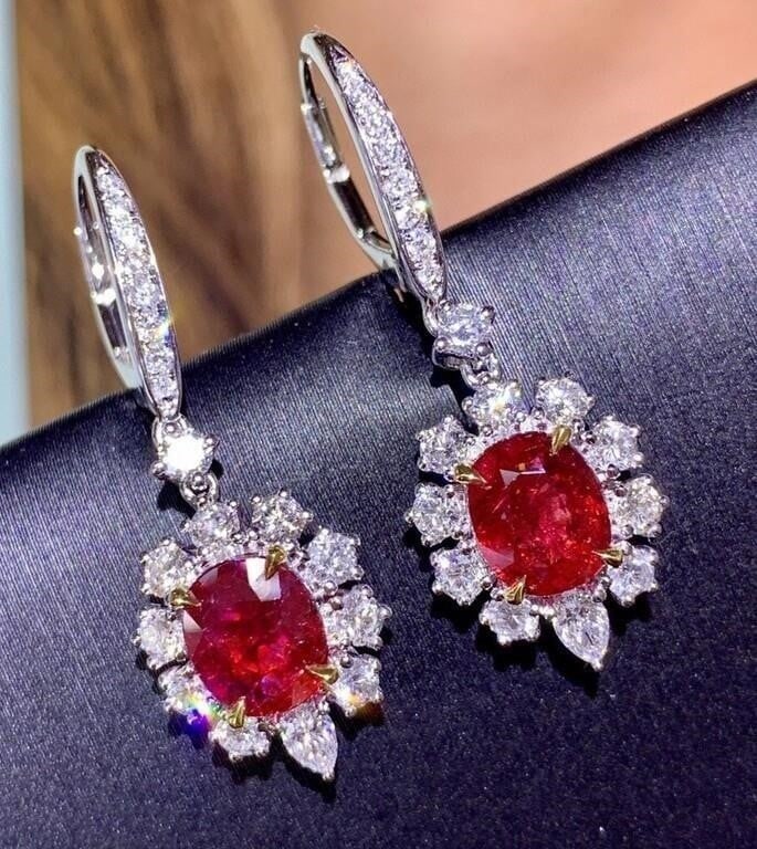 2.3ct Natural Ruby 18K Gold Earrings: Main stone: 2.3cts natural rubies, 18K gold inlaid accessory stone: 1.36cts natural South African high-quality diamonds. Gems are clean and bright, full color, simple and versatile style, the wearing 
