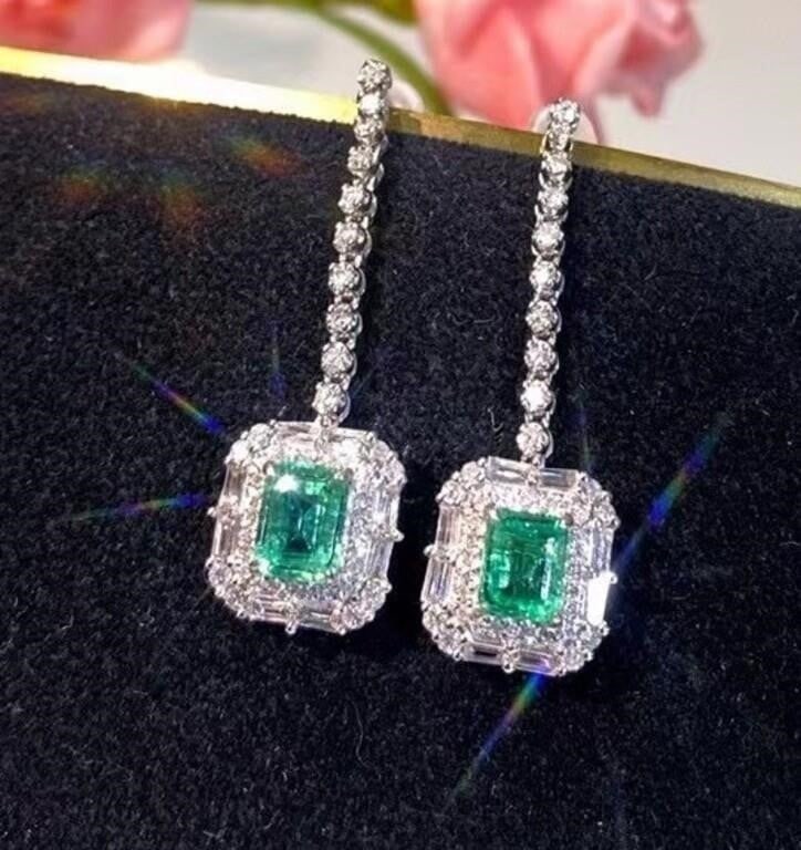 1.1ct Natural Emerald Earring 18K Gold: 18K gold inlaid with 1.1cts natural emeralds and 1.2cts South African high-quality diamonds. Elegant and poised. Attractive brilliant green as main color, minor. Good diamond fire color. Crystal clear