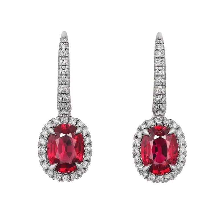 2.3ct Natural Ruby Earrings 18K Gold: 18K gold luxuriously inlaid with 2.3cts natural rubies and natural South African diamonds. Crystal-clear, full and rich in color. Oval-cut. Excellent cutting. International certified natural ruby, wit
