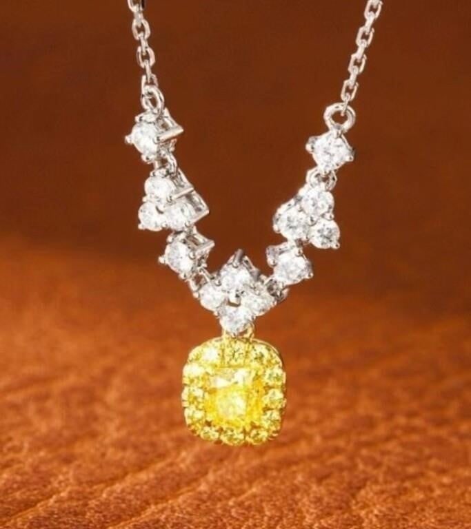Natural Yellow Diamond 18K Gold Necklace: 18K gold set with 0.2ct natural yellow diamond, matched with 0.3cts natural diamonds. Bright color, shining and dazzling, good clarity. Shape: Cushion-shaped. Internationally certified natural Diamond