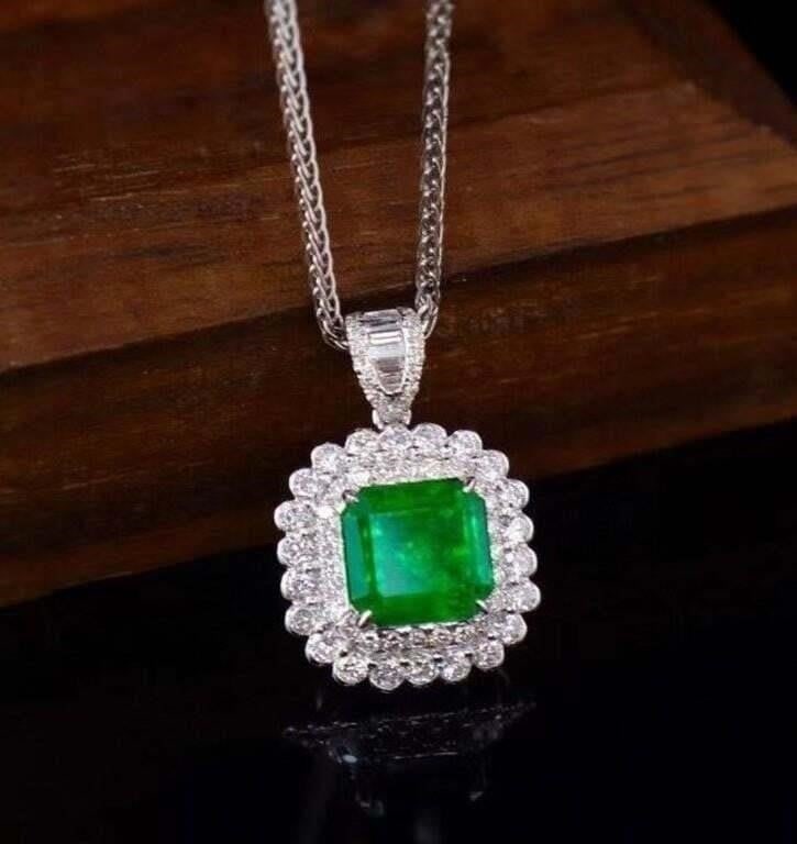 2.2ct Natural Emerald 18K Gold Pendant: 18K gold set with 2.2ct natural emerald and 0.7cts natural South African diamonds, this one is stunning in terms of color and brightness, superb texture. Overall condition is excellent. Internationall