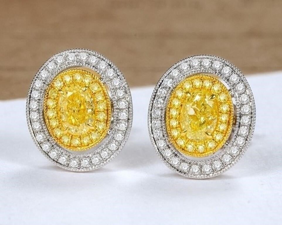 0.6ct Natural Yellow Diamond 18K Gold Earrings: 18K gold set with 0.6cts South African natural yellow diamonds, matched with 0.4cts natural diamonds. Bright color, shining and dazzling, good clarity. Shape: Oval. Cut: Excellent. Internationally