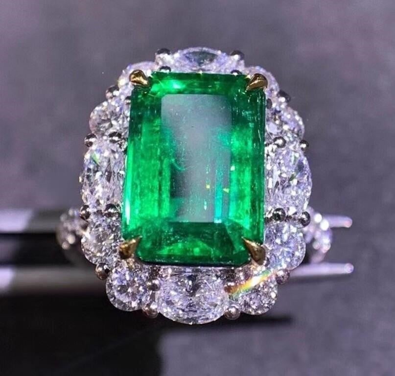 4.8ct Natural Emerald Ring 18K Gold: 18K gold inlaid with 4.8ct natural vivid green emerald and 1.8cts natural South African diamonds. Good clarity, crystal-clear, rich in color. Full of fire color. Standard cutting. International