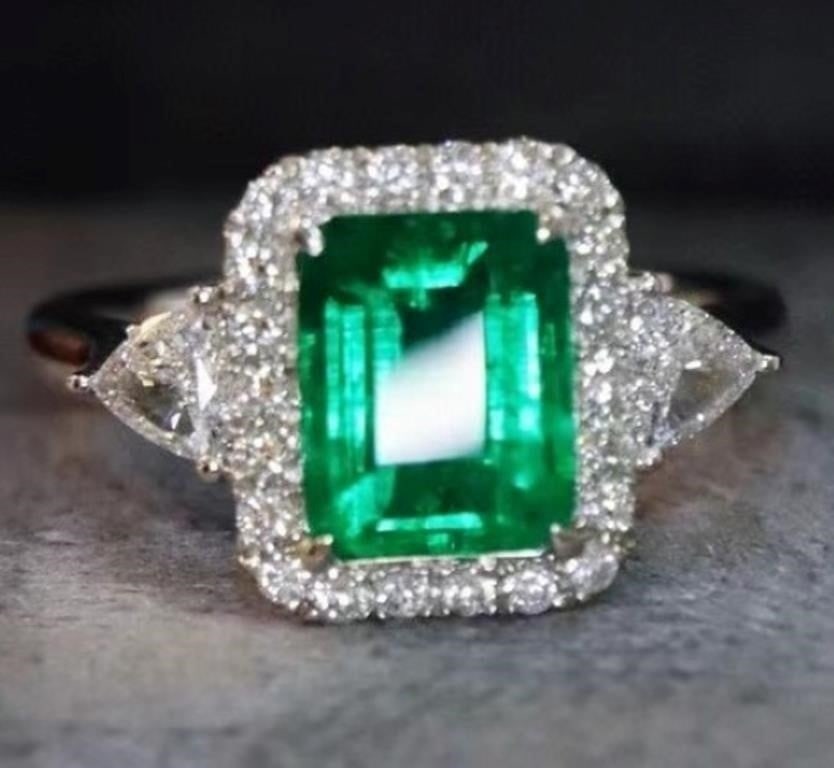 1.5ct Zambian Emerald 18K Gold Ring: 18K gold deluxe set with 1.5ct Zambian natural emerald and 0.6cts natural South African diamonds. The colors are bright. Crystal-clean, shining and dazzling, fashion and simplicity, extremely good wea