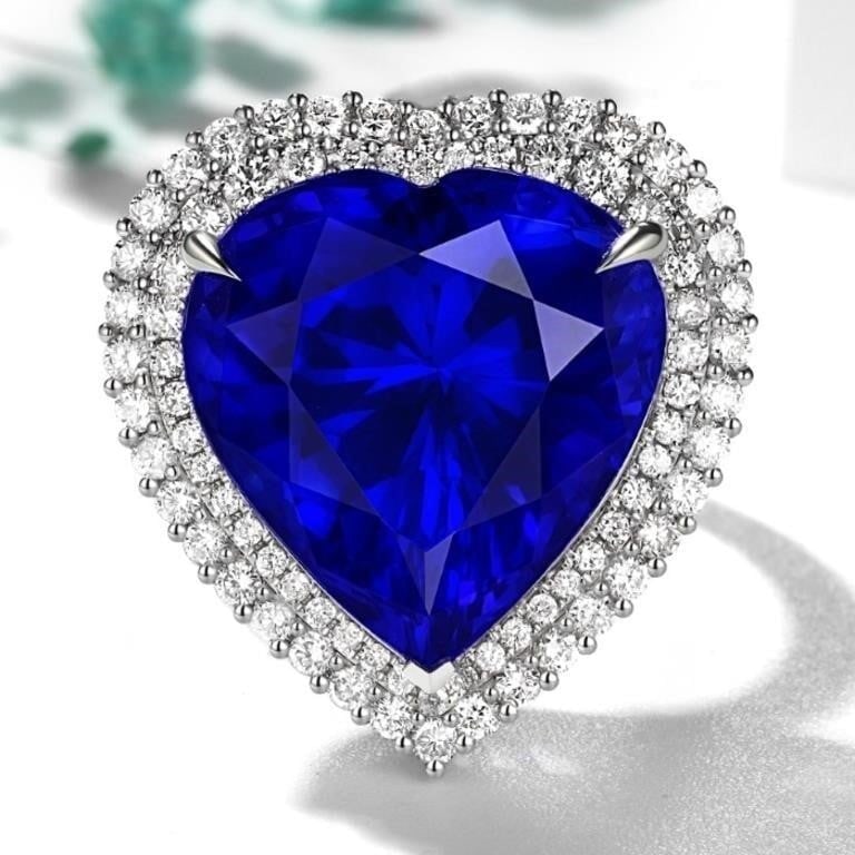 18.7ct Natural Tanzanite 18K Gold Ring: Main stone: 18.7ct natural tanzanite, 18K gold luxury inlaid 1.3cts natural South African high-quality diamonds, full color, bright colors, crystal-clear, good fire, shining and dazzling. Overall cond
