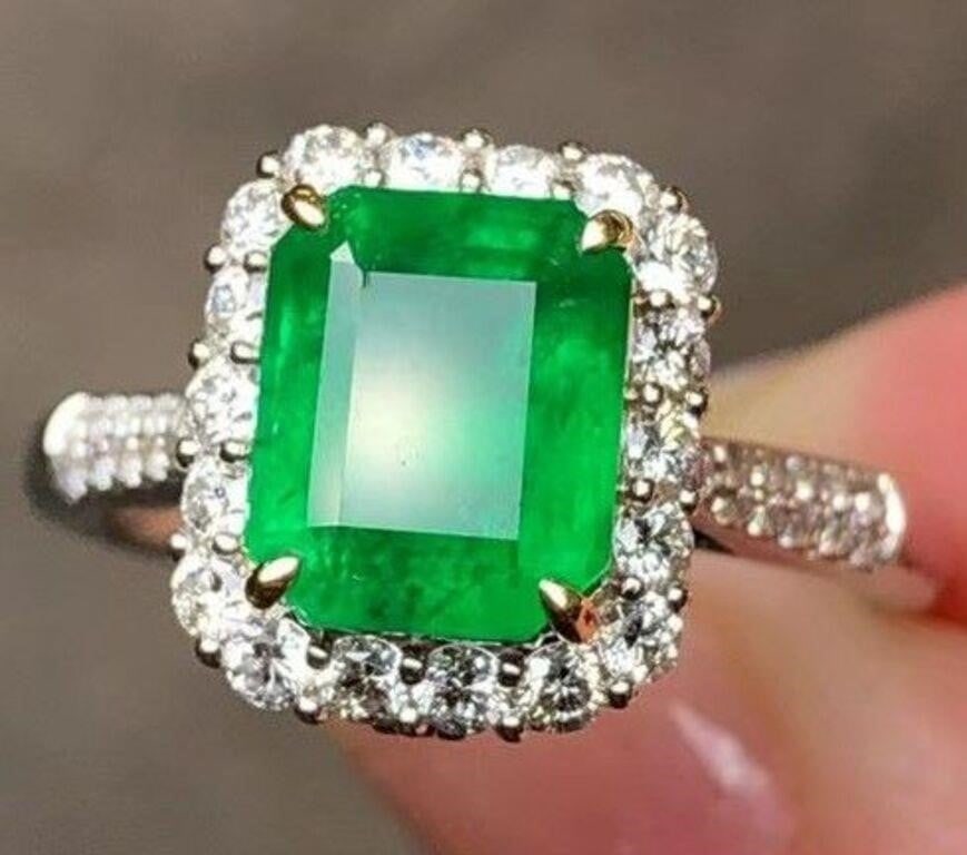 2.4ct Natural Emerald Ring 18K Gold: 18K gold set with 2.4ct Colombian natural emerald and natural South African diamonds. Crystal-clear, clean and transparent, vivid green. Internationally certified natural emeralds. Possess an internat