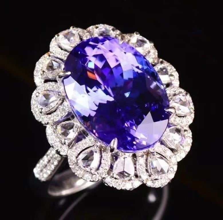 11.2ct Natural Tanzanite 18K Gold Ring: 18K gold inlaid with 11.2ct natural tanzanite and natural South African high-quality diamonds. Gorgeous design, attractive style, bright color, clean-crystal, good clarity. Shape: Oval. Cut: