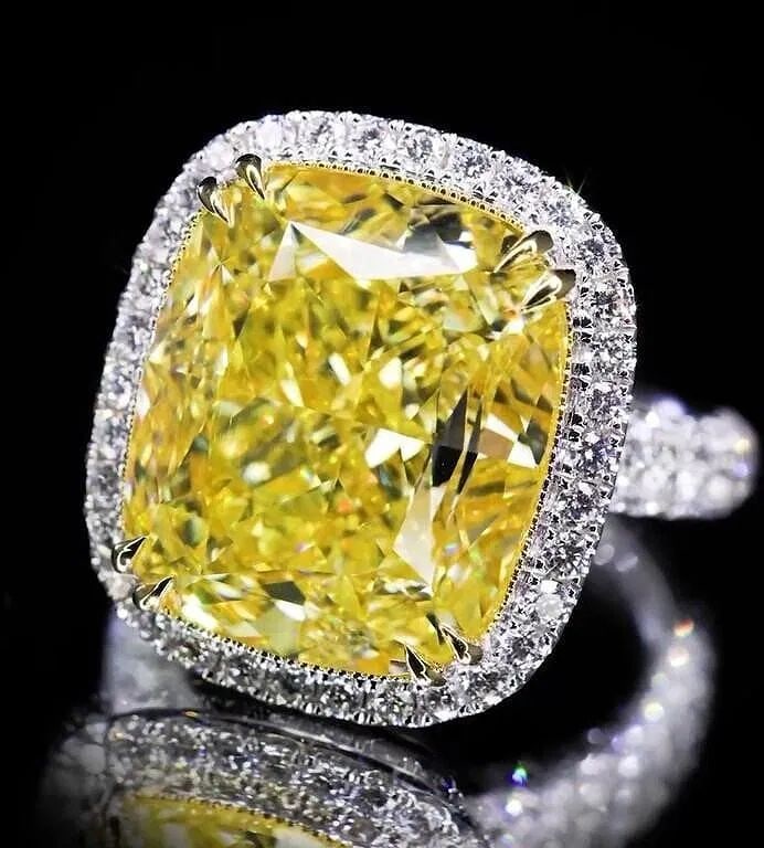 20ct Natural Yellow Diamond 18Kt Gold Ring: Handcrafted from heavy gold, very lavish and splendid. 18Kt gold inlaid natural South African high quality diamonds, main stone: 20ct Yellow Diamond. Cushion-shaped yellow diamond adopts bright cuttin