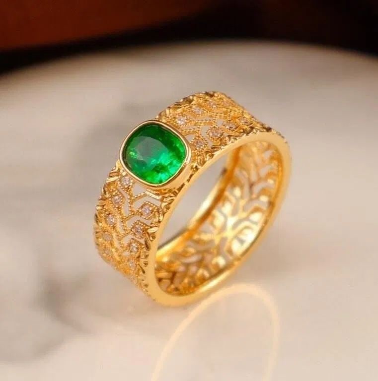 18Kt Gold Natural Emerald Ring: 18Kt gold set with 0.65ct natural emerald and 0.18cts natural diamonds, this one is stunning in terms of color and brightness, superb texture. Internationally certified natural Emerald, comes with