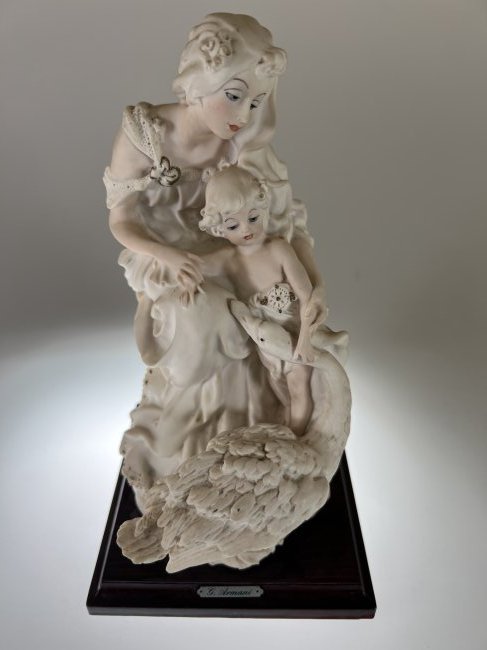 GIUSEPPE ARMANI MOTHER CHILD & SWAN CAPODIMONTE 1987 FLORENCE: GIUSEPPE ARMANI MOTHER CHILD & SWAN CAPODIMONTE 1987 FLORENCE. G. Armani Plaque on wood base. Signed G Armani on side. Measures approx. 6 1/2" deep x 5 1/4" wide x 10 1/2" tall