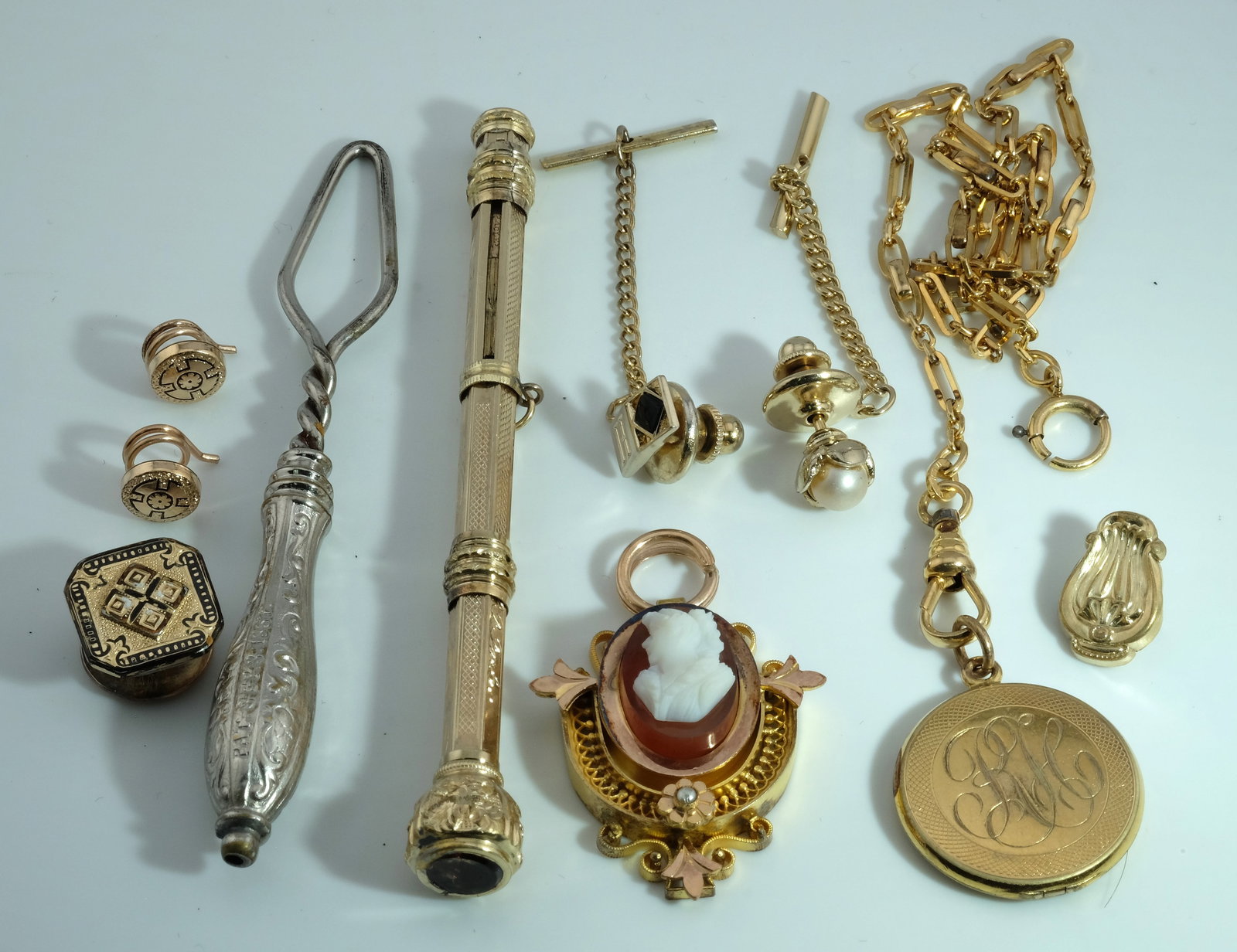 Collection of Rare Victorian Jewelry: Including ornately engraved pin, pendant, brooches and more.